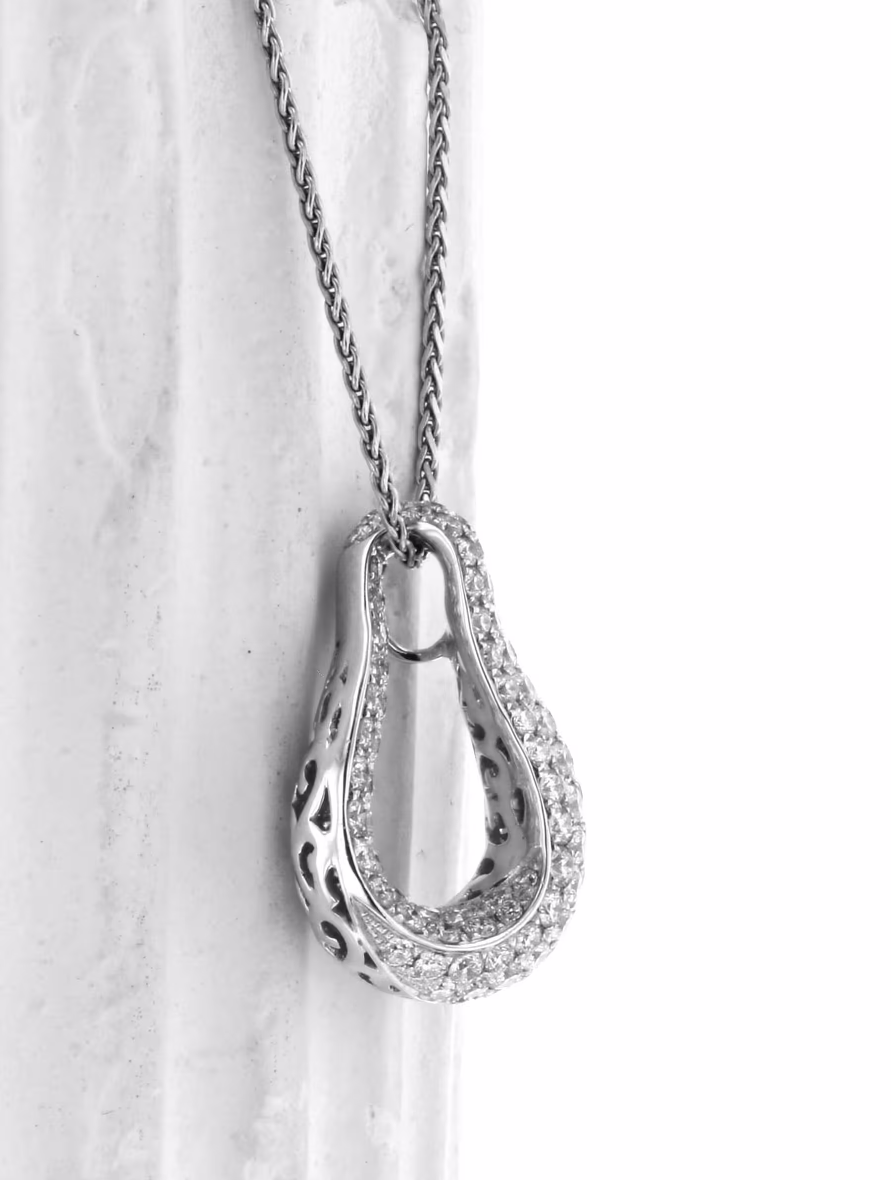 Elegant 18K gold pendant with pave diamonds, perfect for luxury jewelry lovers.