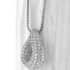 Elegant 18K gold pendant with pave-set diamonds, perfect for special occasions.