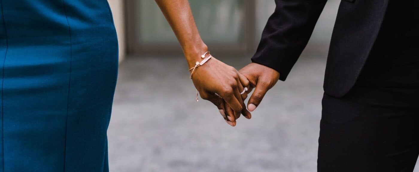 Business professionals shaking hands, representing trust and gold exchange services in Houston.