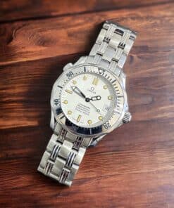 Omega Seamaster Professional Midsize watch with stainless steel bracelet and white dial.