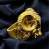 Gold Ram Head Ring with intricate detailing.