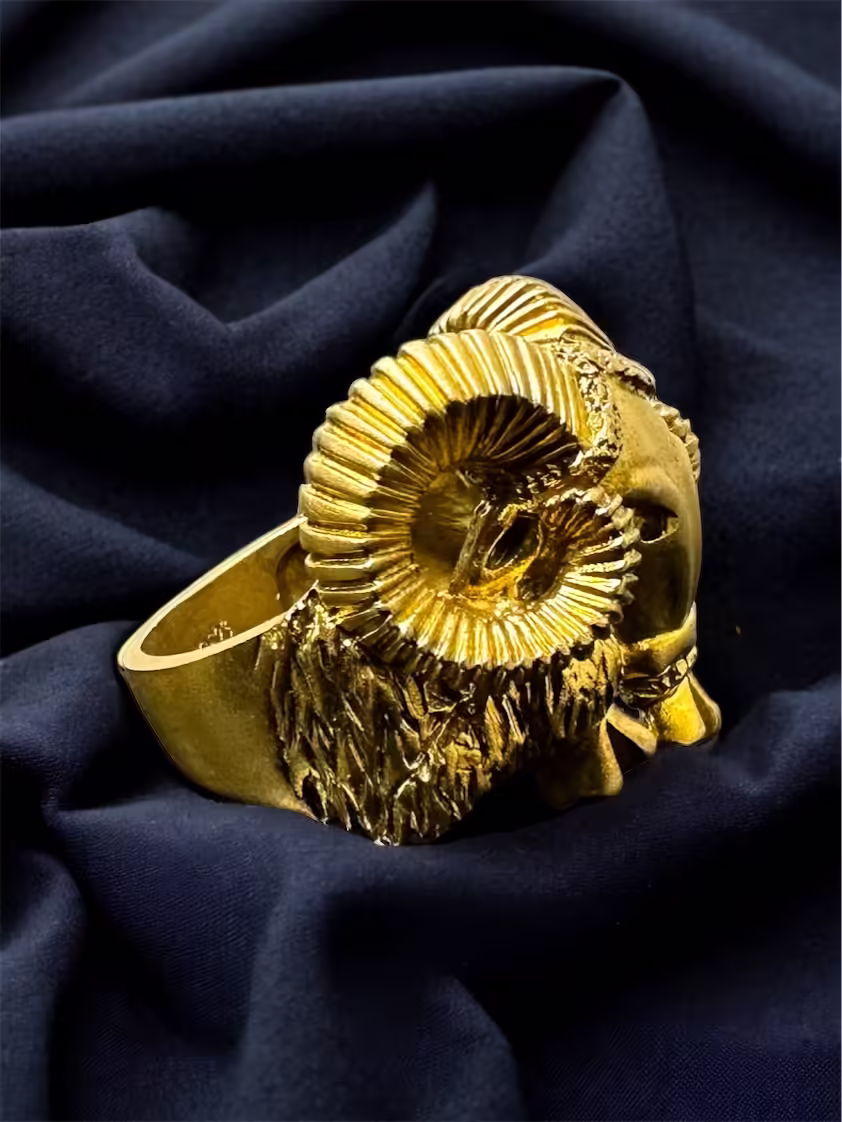 Gold Ram Head Ring with intricate detailing.