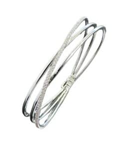 Elegant silver bangle with sparkling diamonds, perfect for special occasions or everyday wear.