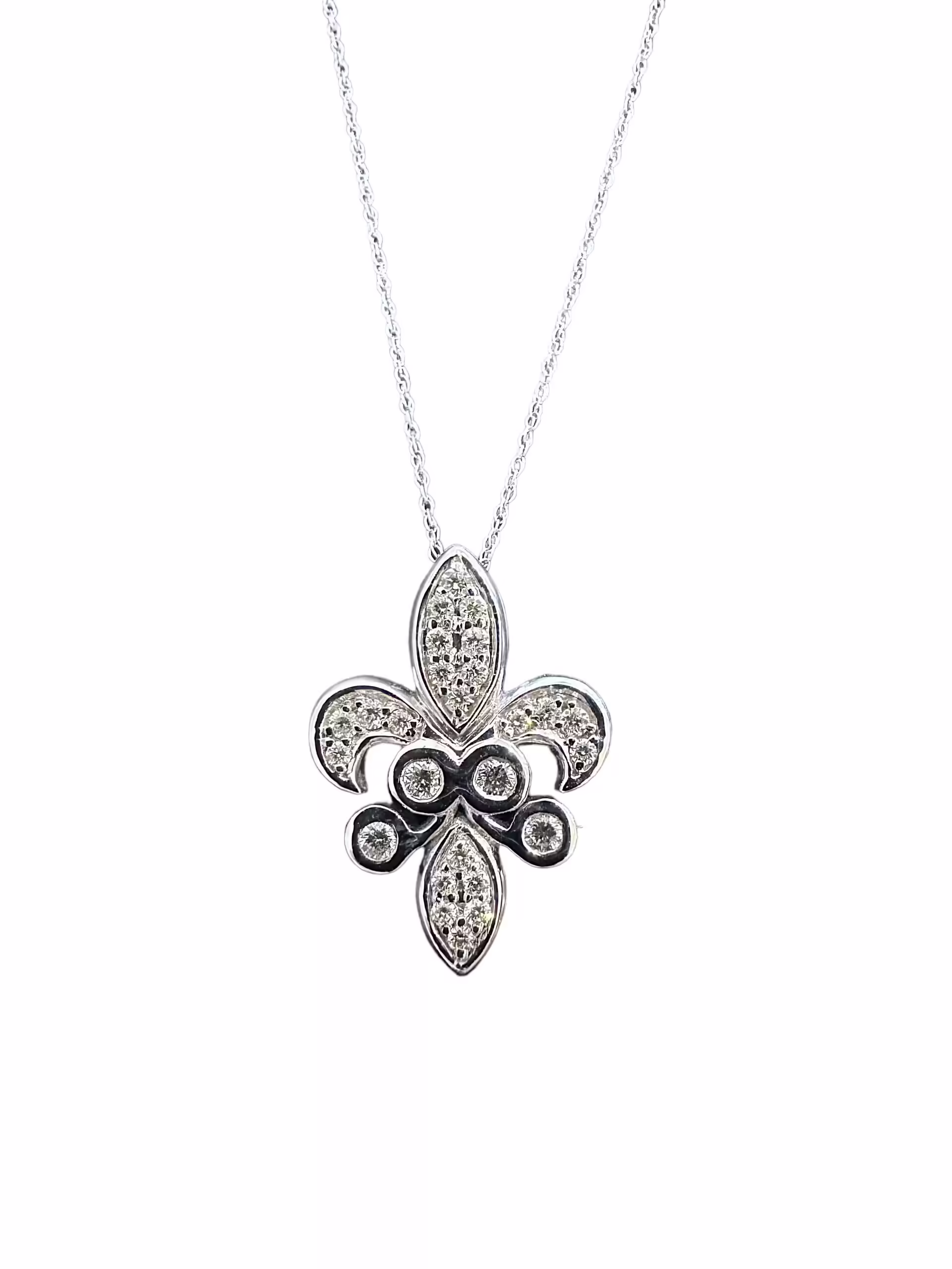 Fleur de Lis pendant with sparkling diamonds on a silver chain.
