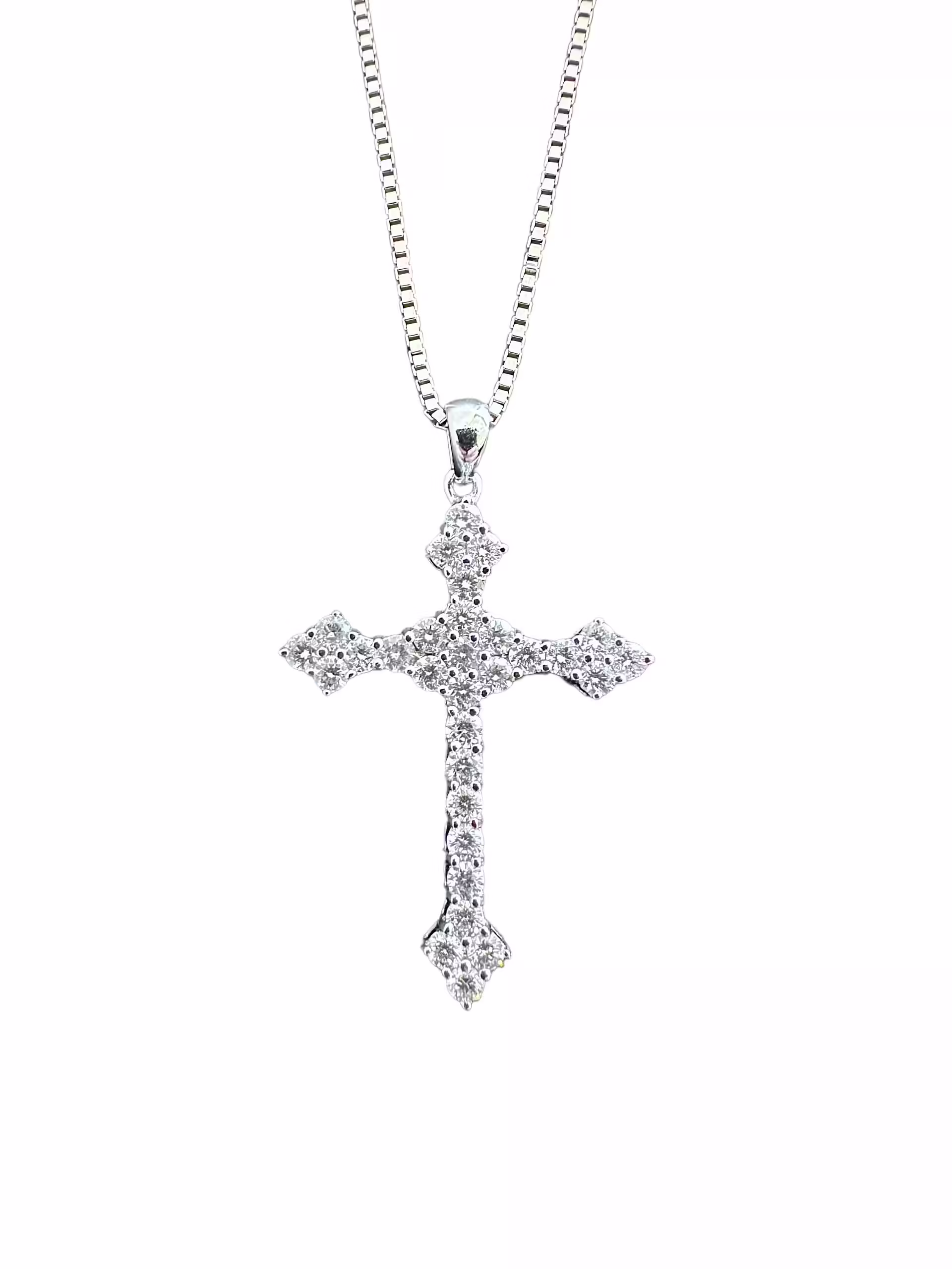 Elegant diamond cross pendant necklace in sterling silver. Perfect for religious or stylish jewelry.