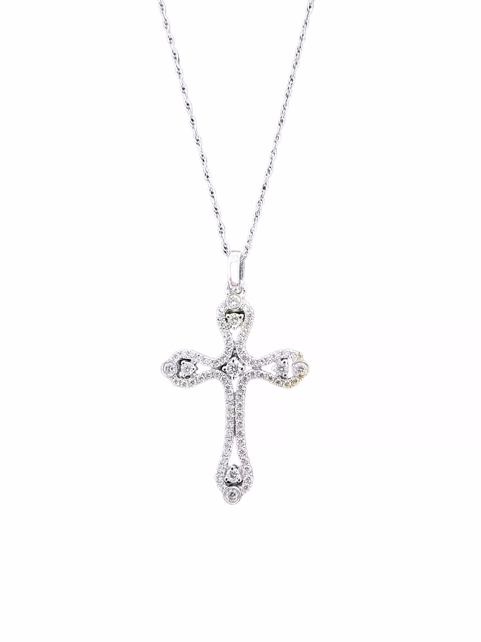 Elegant diamond cross pendant necklace in sterling silver. Perfect for religious or special occasion.
