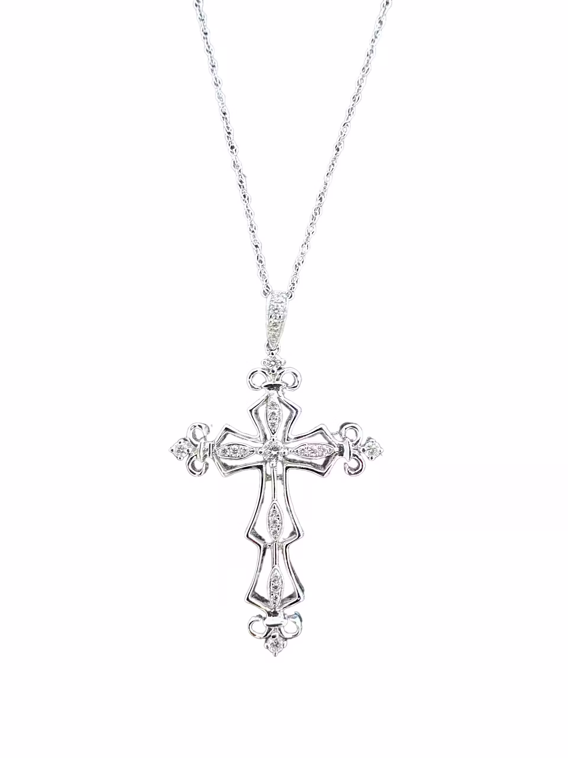 Elegant diamond cross pendant on a silver chain, perfect for religious jewelry lovers.