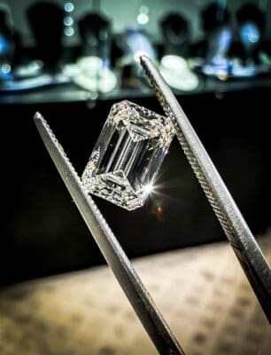 Lab Grown Diamond displayed with tweezers at Houston Gold Exchange.