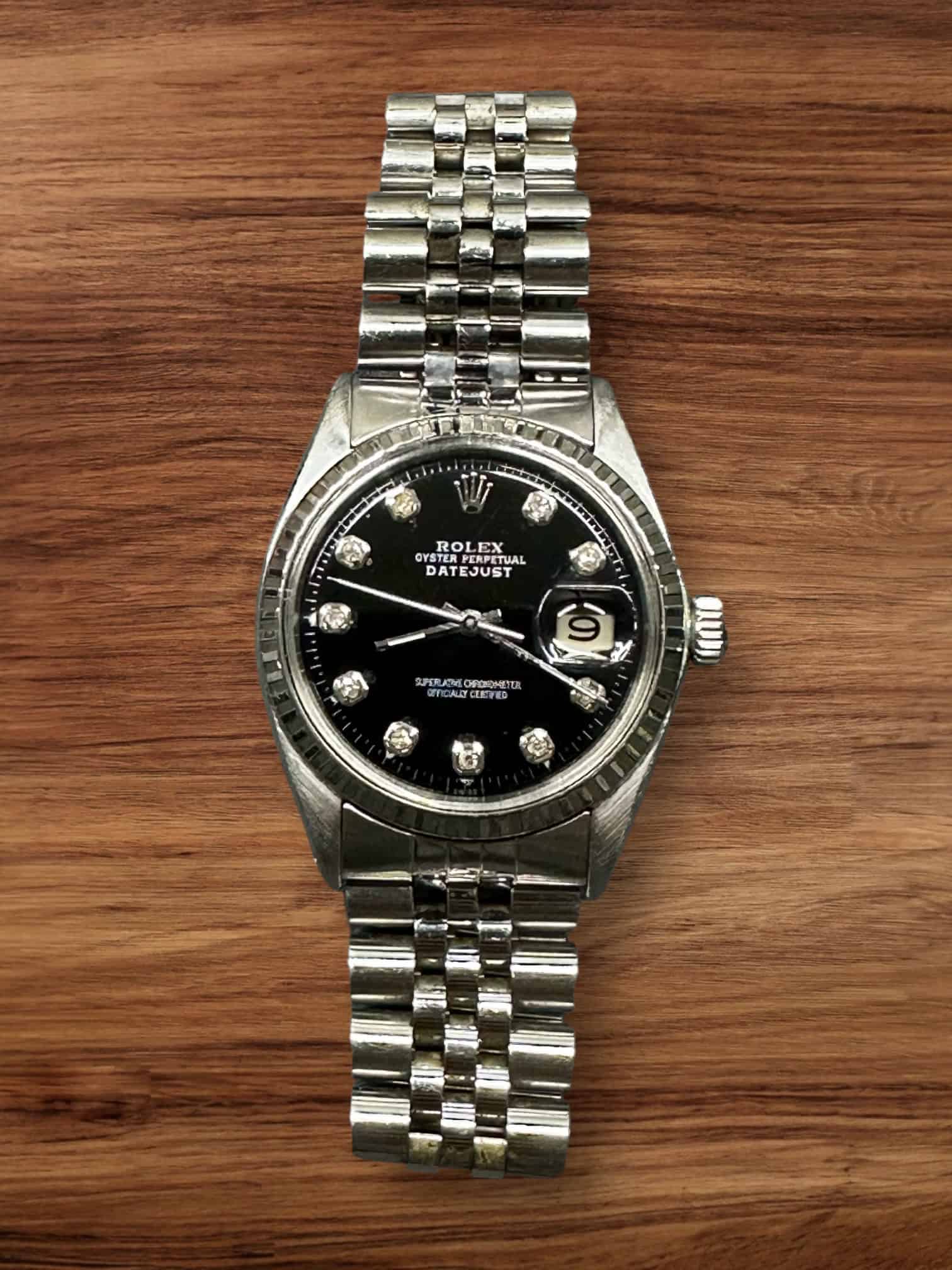 Rolex Datejust 36mm watch with diamond hour markers and stainless steel bracelet.